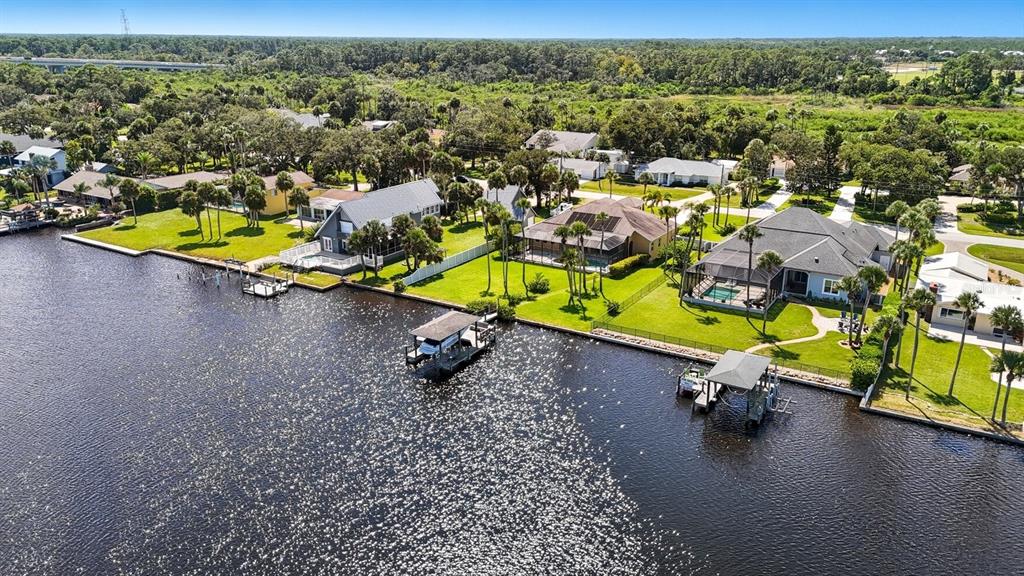 430 Lambert Avenue Flagler Beach, FL 32136 - Photo 6 of 63 an aerial view of a swimming pool with outdoor seating