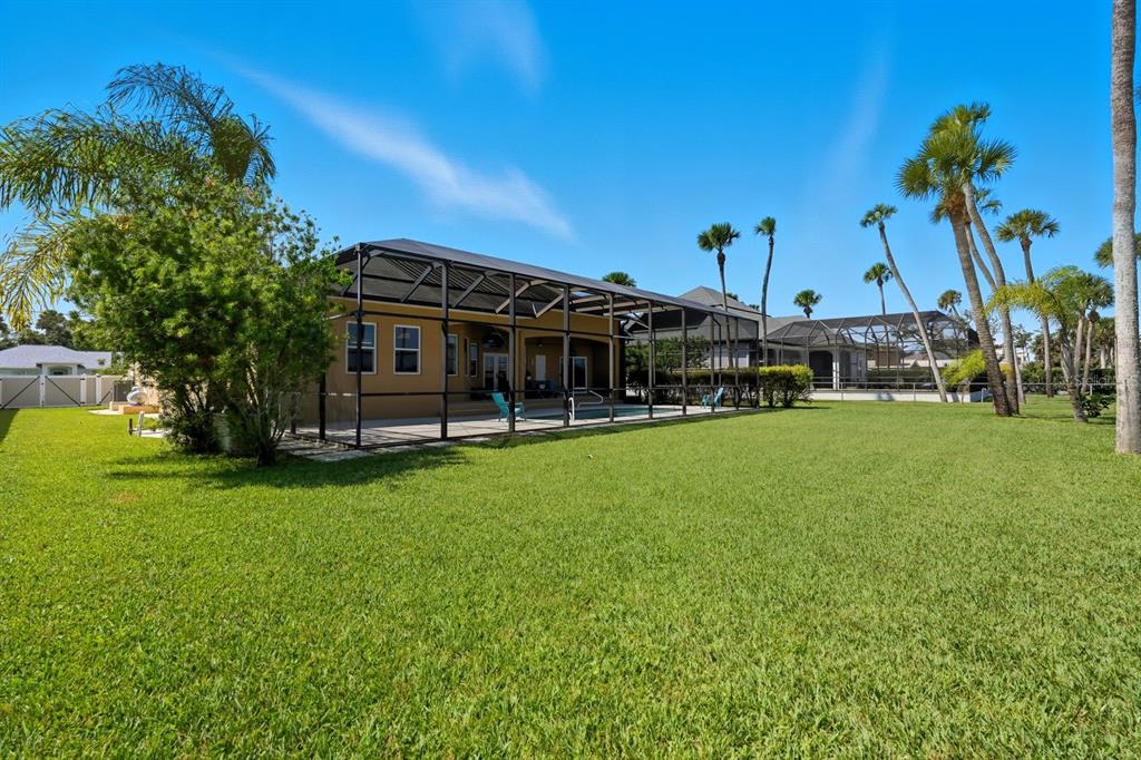430 Lambert Avenue Flagler Beach, FL 32136 - Photo 63 of 63 a view of a house with a big yard