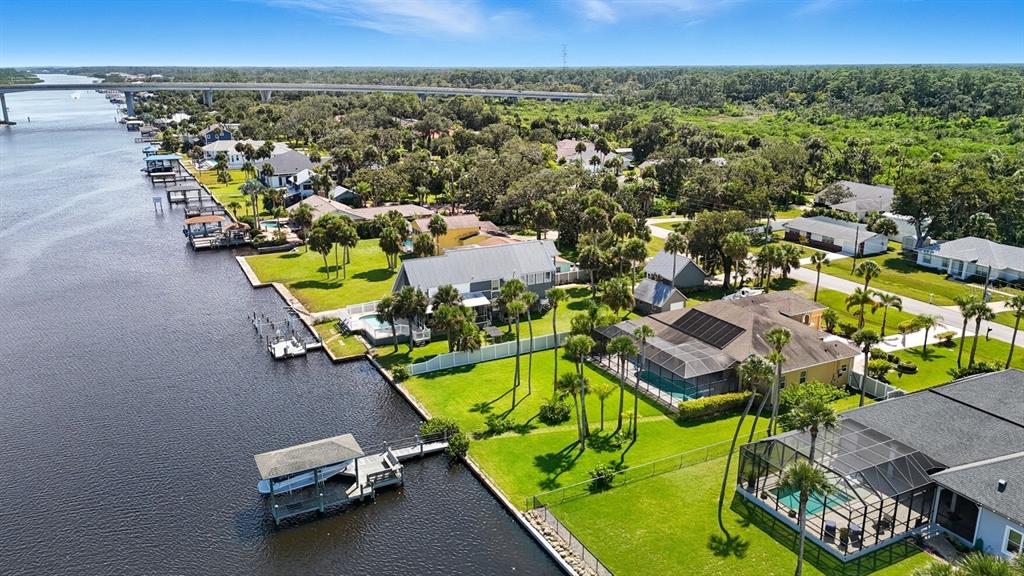 430 Lambert Avenue Flagler Beach, FL 32136 - Photo 8 of 63 an aerial view of a swimming pool with seating area