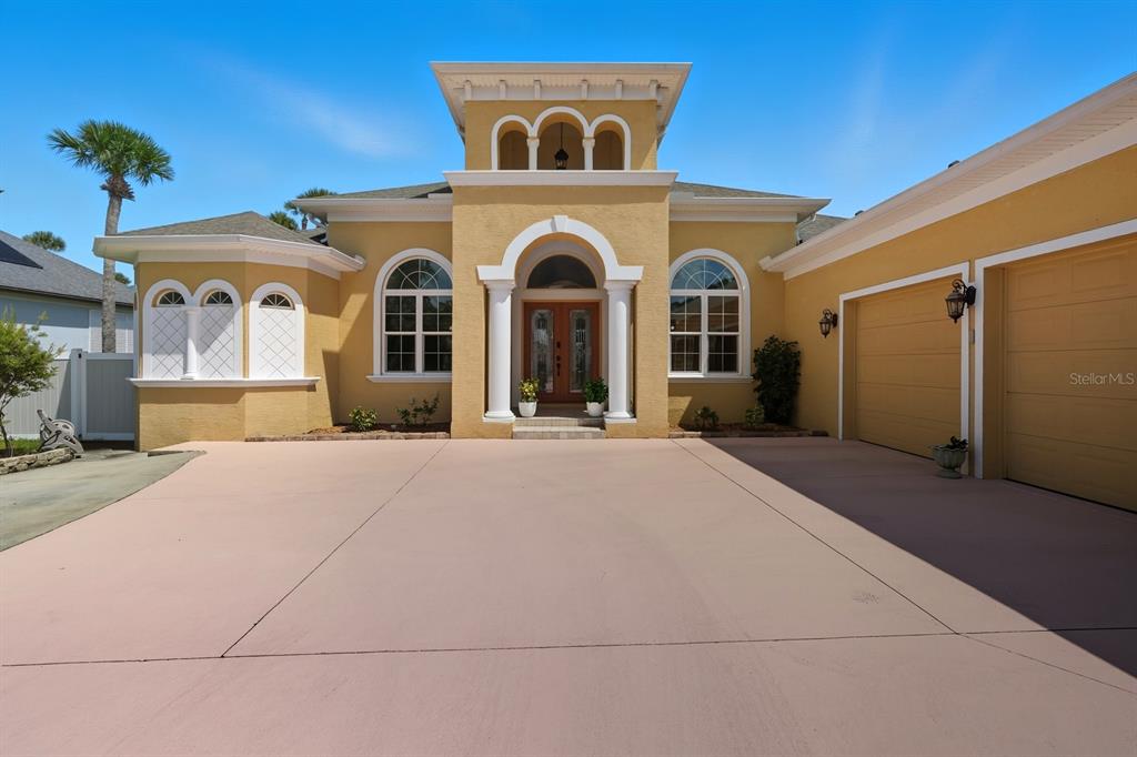 430 Lambert Avenue Flagler Beach, FL 32136 - Photo 10 of 63 a front view of a house with a yard