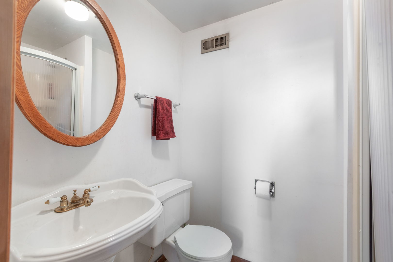 669 White Pine Road Buffalo Grove, IL 60089 - Photo 13 of 16 a bathroom with a sink and a mirror
