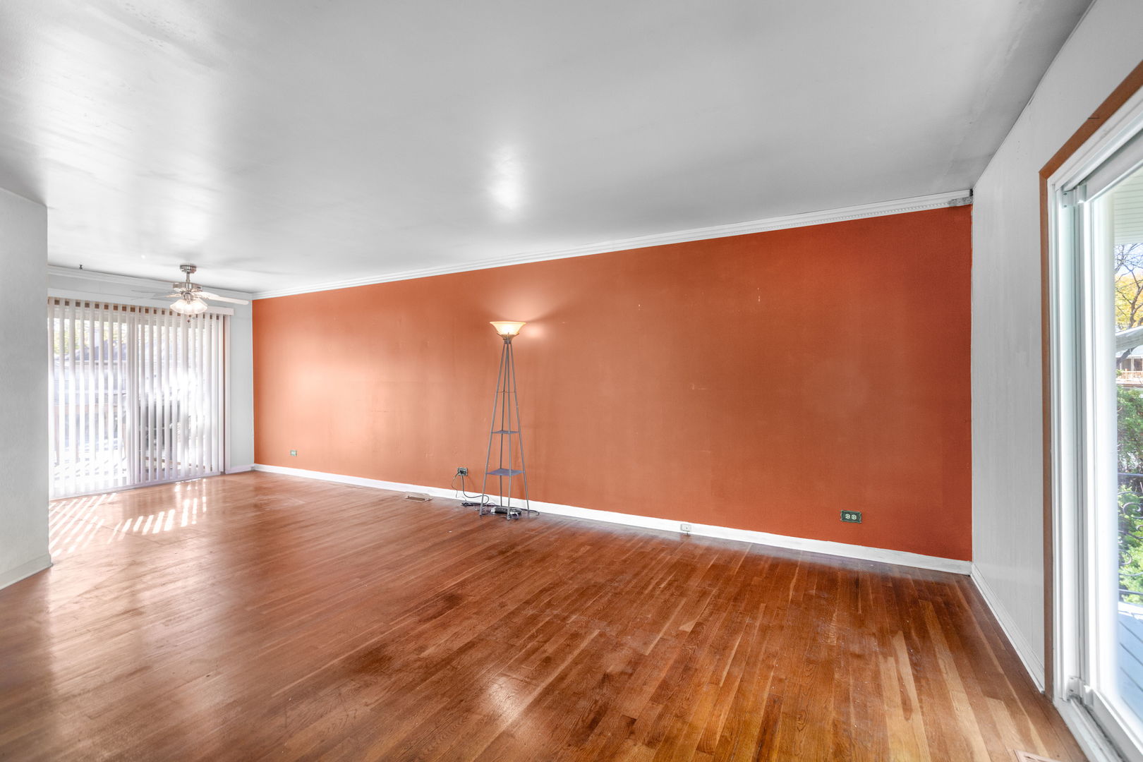 669 White Pine Road Buffalo Grove, IL 60089 - Photo 3 of 16 a view of an empty room with wooden floor and a window