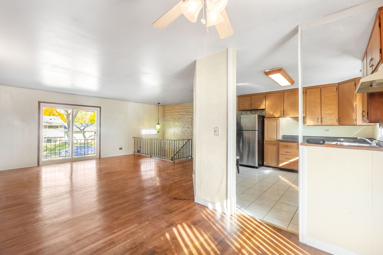 669 White Pine Road Buffalo Grove, IL 60089 - Photo 6 of 16 a view of a big room with wooden floor and a bathroom