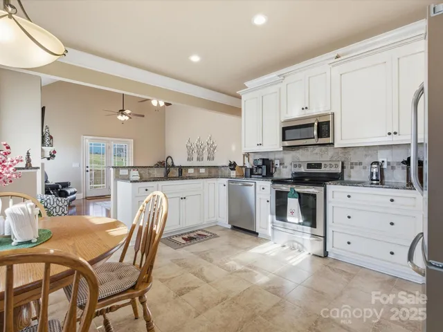 a kitchen with cabinets a sink and a stove