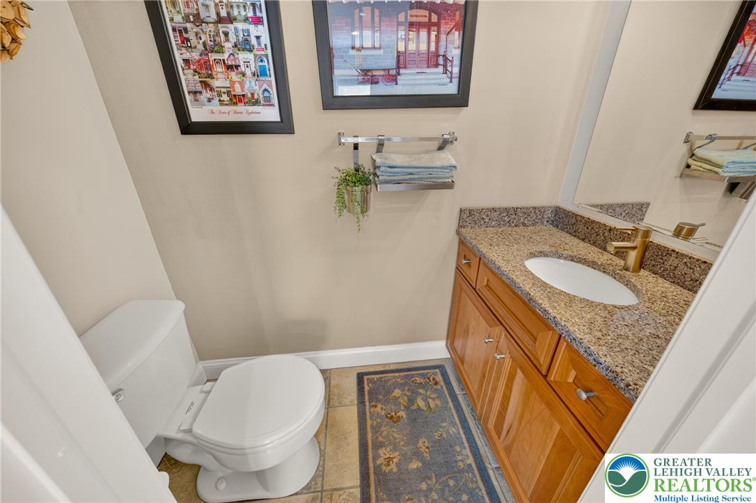 1702 Red Bud Road Quakertown, PA 18951 - Photo 25 of 68 A compact, well-appointed bathroom featuring a single vanity with granite counters and durable tile flooring.