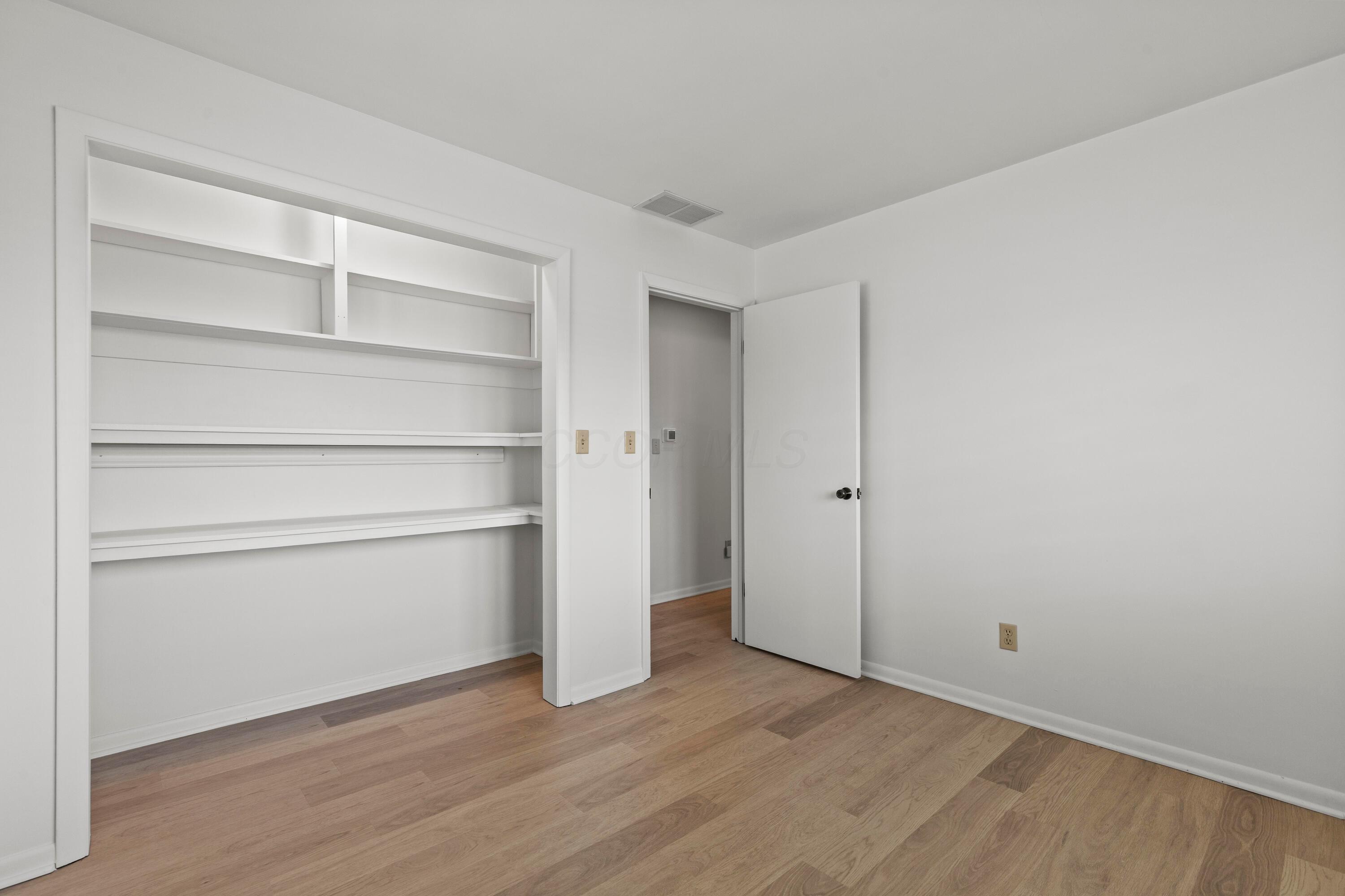 6982 Lee Road Westerville, OH 43081 - Photo 34 of 71 • New laminate flooring ~ 2024 • White painted walls • Open closet • 2” blinds