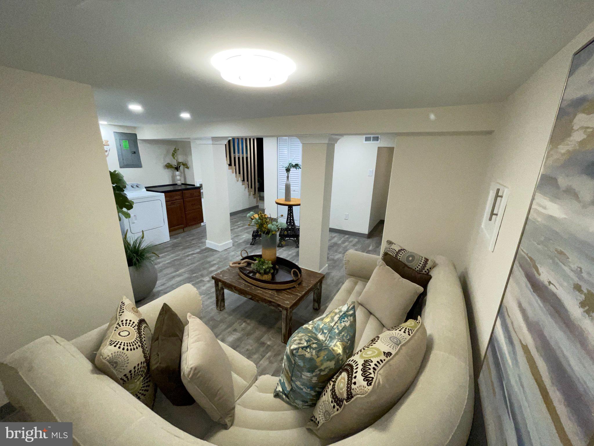 3712 West Cold Spring Lane Baltimore, MD 21215 - Photo 5 of 39 Cozy basement retreat with modern flair.