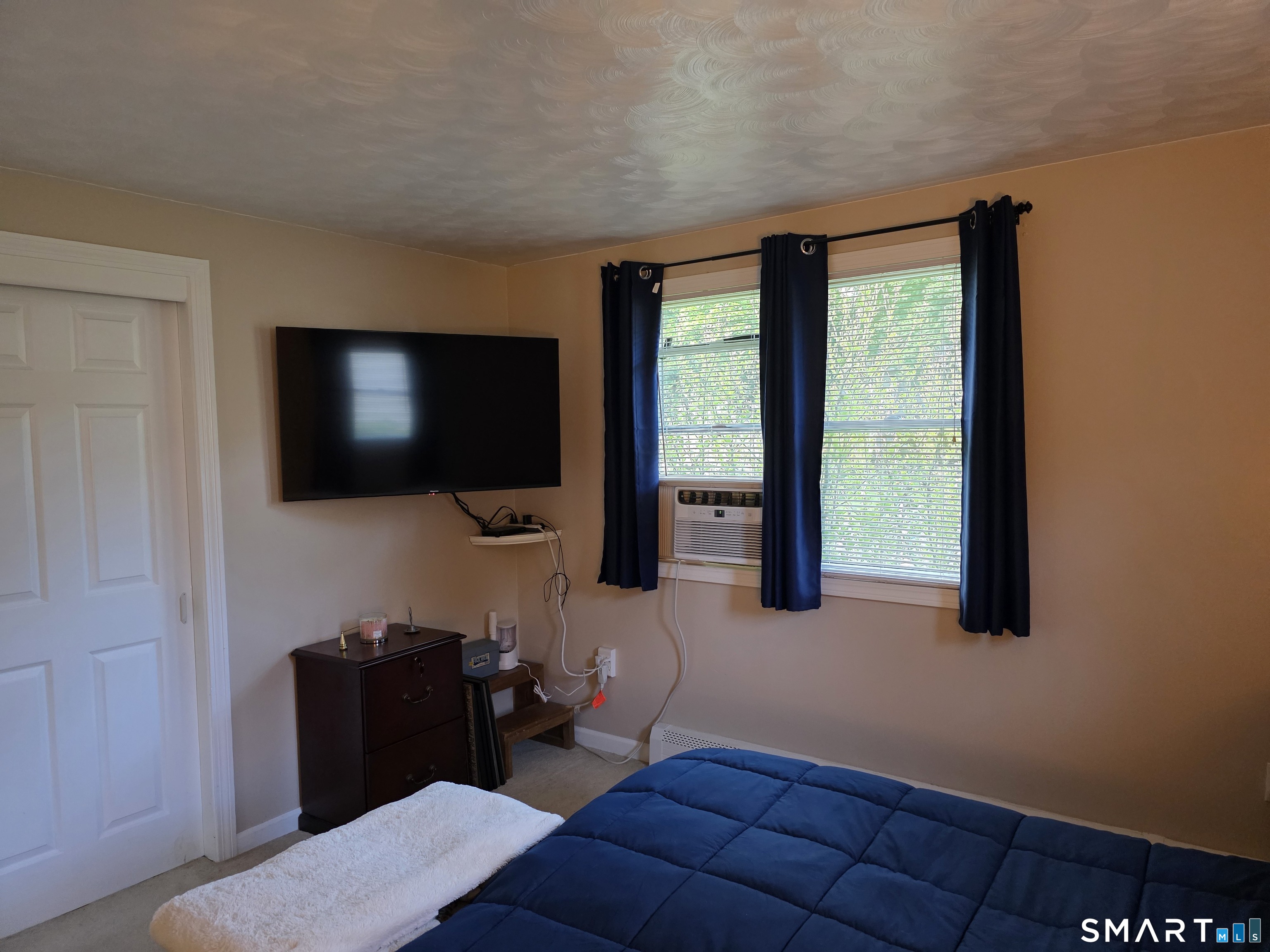15 Van Buren Road Enfield, CT 06082 - Photo 24 of 40 a living room with furniture and a flat screen tv