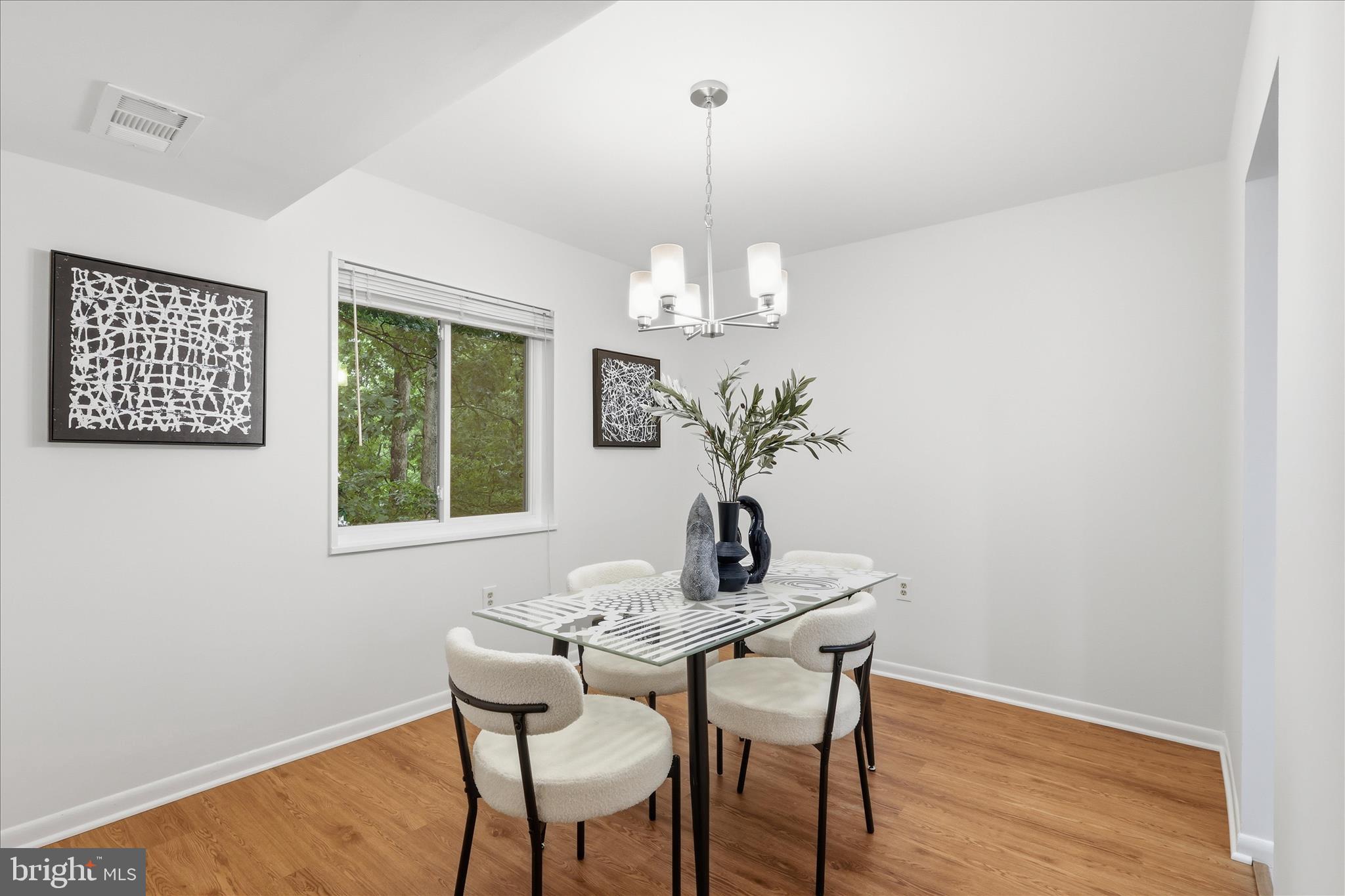 1540 Northgate Square, Unit 21B Reston, VA 20190 - Photo 11 of 24 a dining room with furniture and window