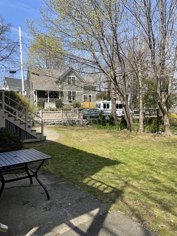 15 Harris Street, Unit 2 Marblehead, MA 01945 - Photo 12 of 12 a view of a swimming pool with lawn chairs and plants