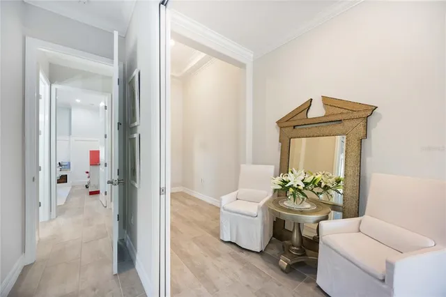 a bedroom with a large bed and a large window