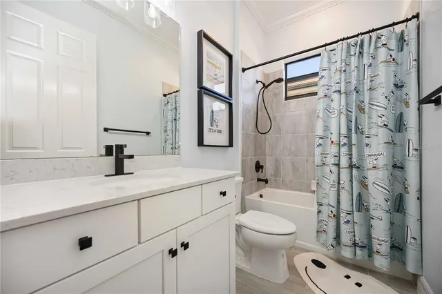 a view of a backyard with table and chairs under an umbrella