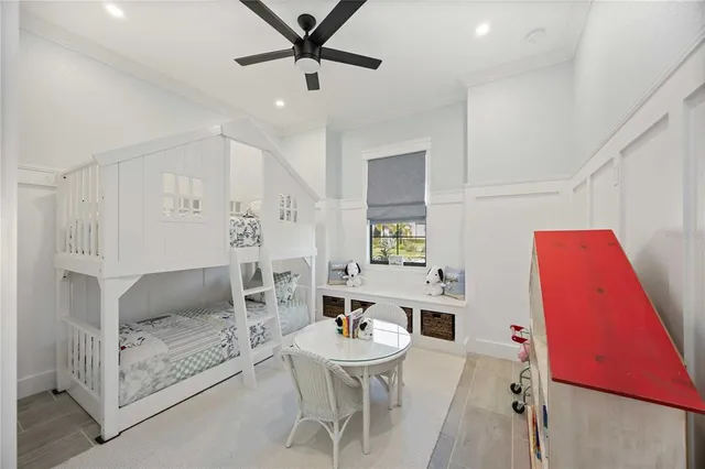 an aerial view of residential houses with outdoor space and lake view