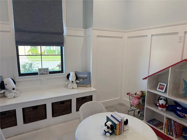 an aerial view of a house with outdoor space and lake view