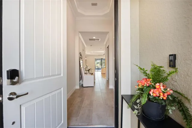 a large kitchen with a table and chairs