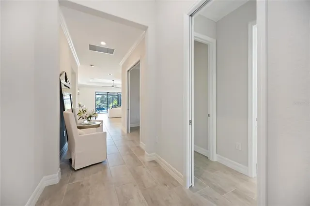 a large kitchen with stainless steel appliances a lot of counter space and wooden floor