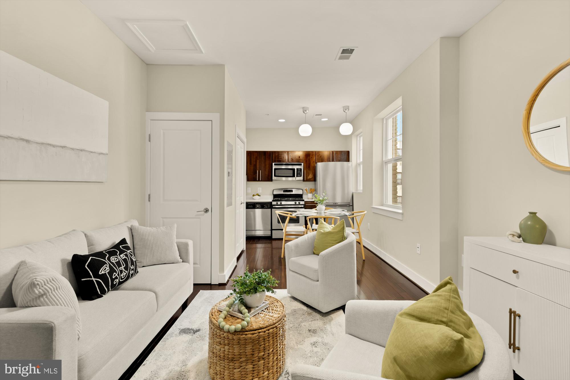 315 G Street Northeast, Unit 303 Washington, DC 20002 - Photo 1 of 16 a living room with furniture and kitchen view