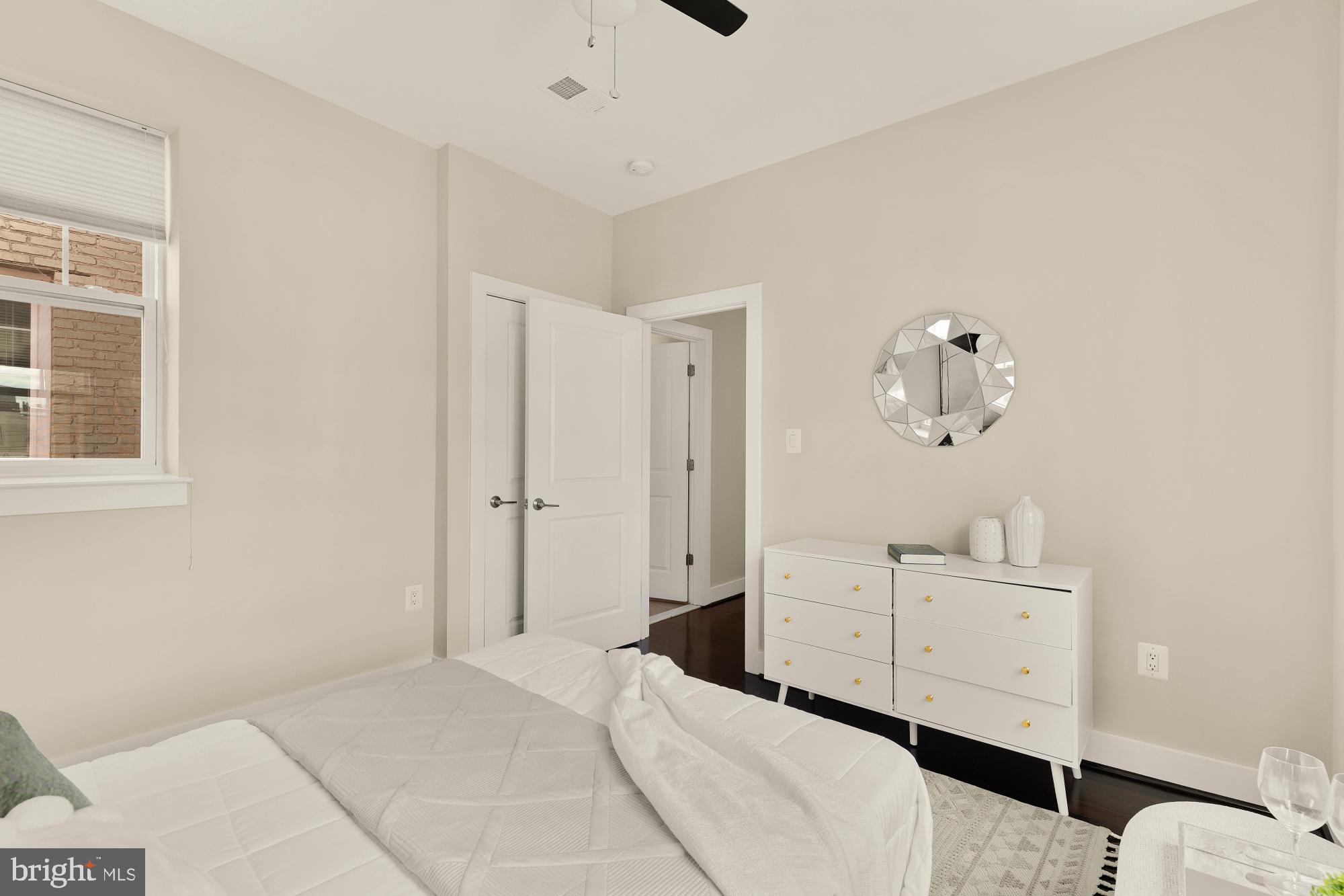 315 G Street Northeast, Unit 303 Washington, DC 20002 - Photo 11 of 16 a spacious bedroom with a bed and a window