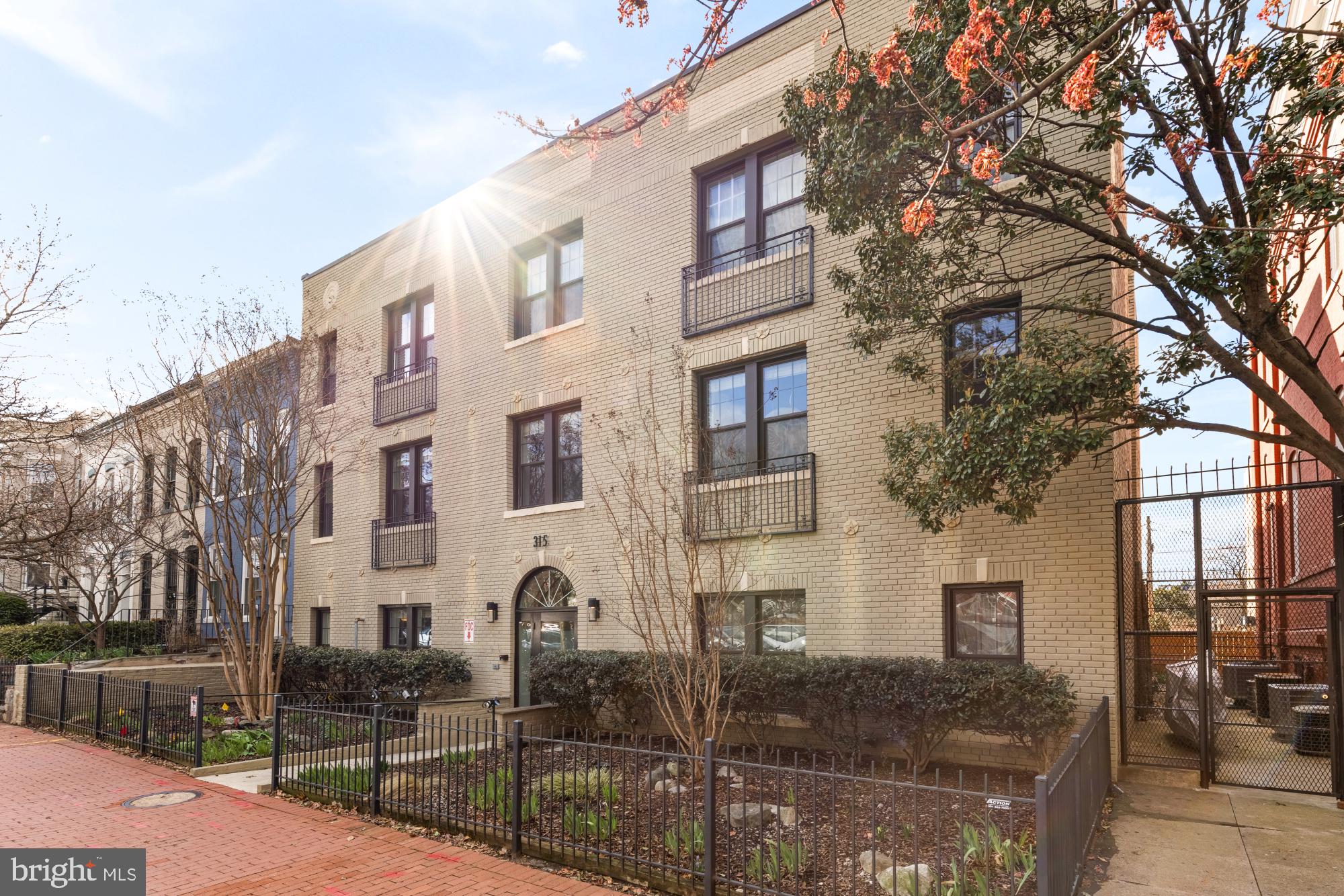 315 G Street Northeast, Unit 303 Washington, DC 20002 - Photo 15 of 16 a front view of a building with street view