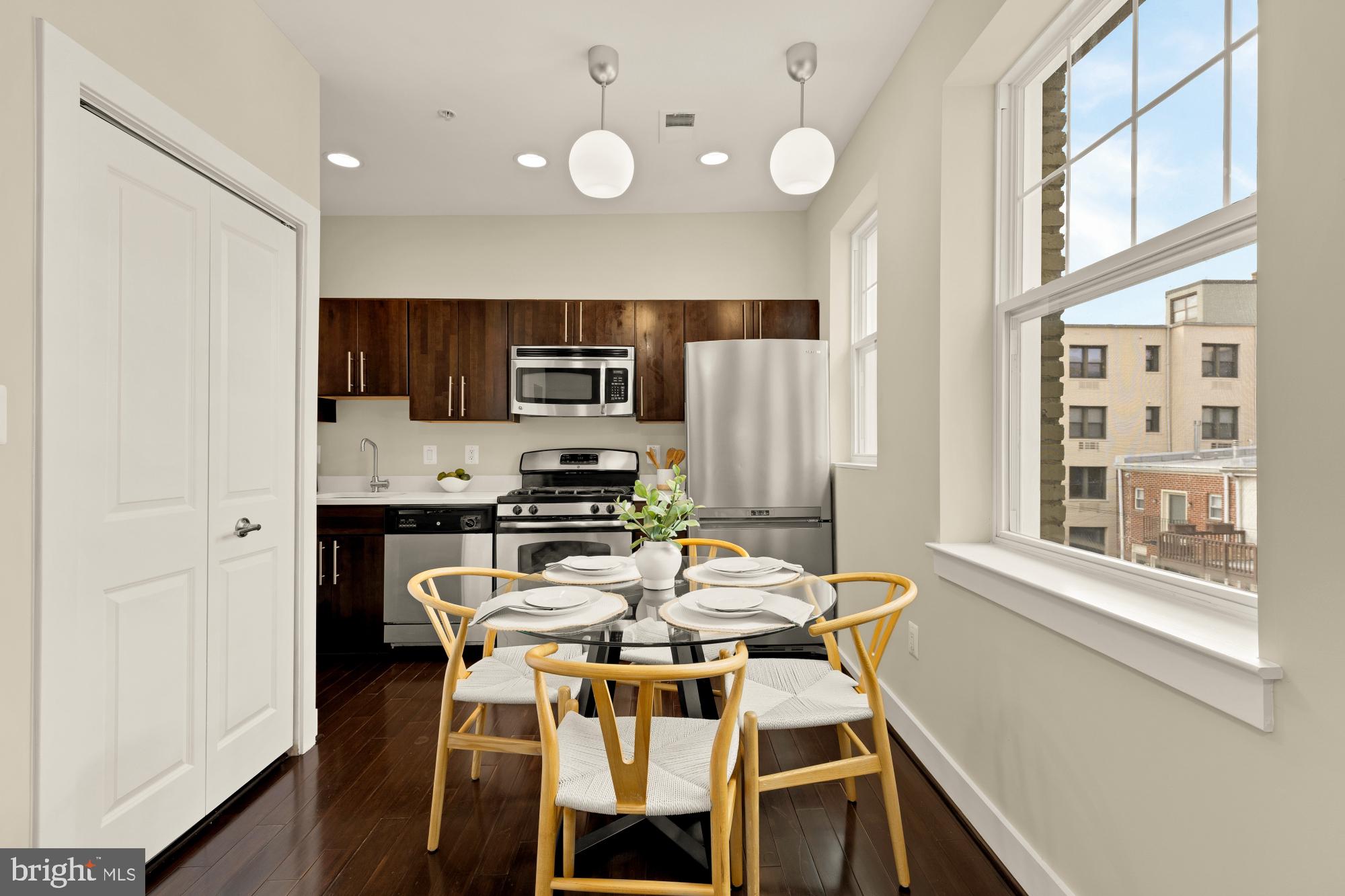 315 G Street Northeast, Unit 303 Washington, DC 20002 - Photo 3 of 16 a view of a dining room with furniture and a window