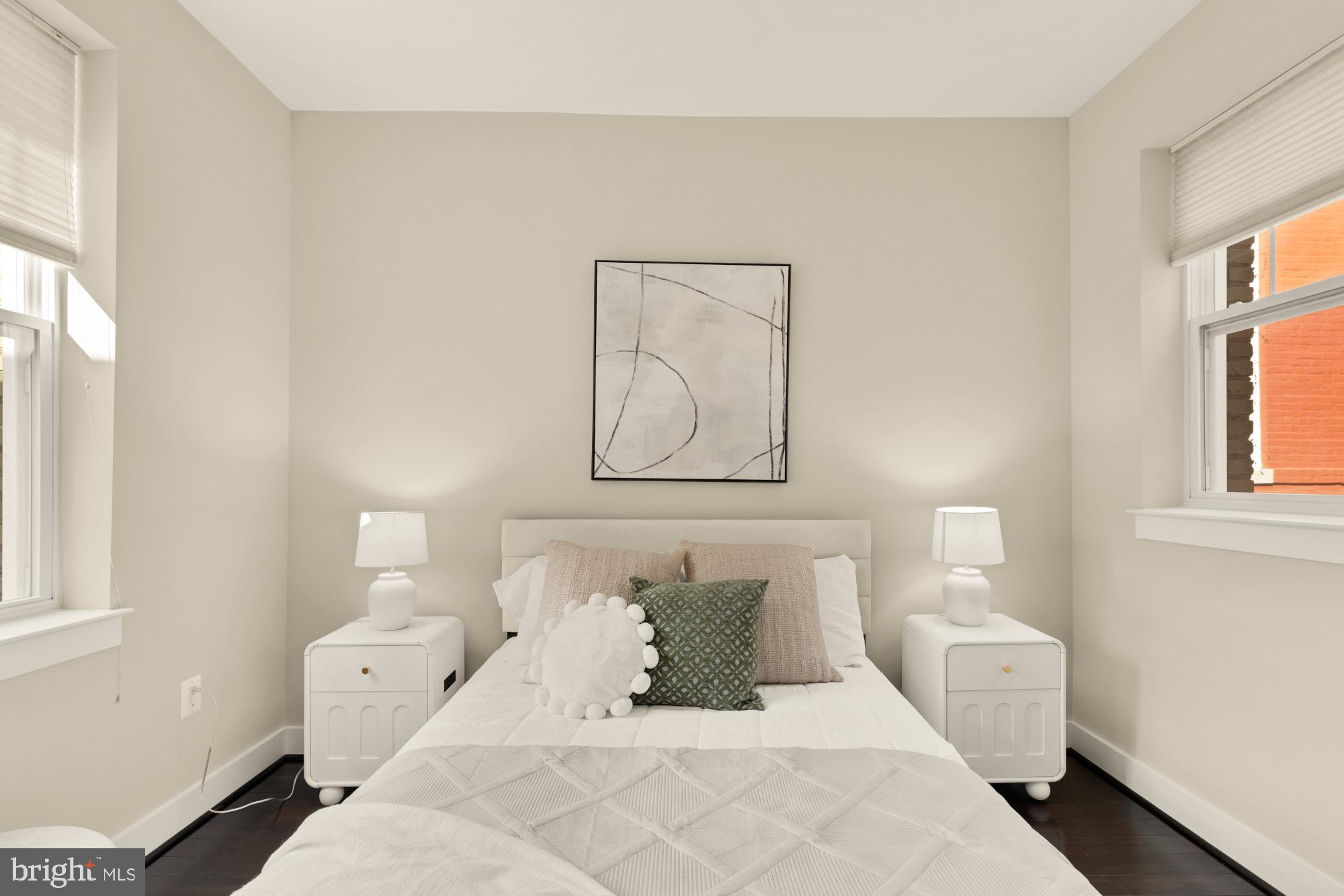315 G Street Northeast, Unit 303 Washington, DC 20002 - Photo 10 of 16 a bedroom with a white bed and white walls with window