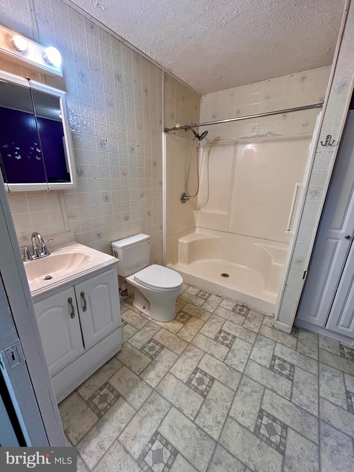 208 Justice Way Elkton, MD 21921 - Photo 11 of 23 a bathroom with a sink a toilet and shower