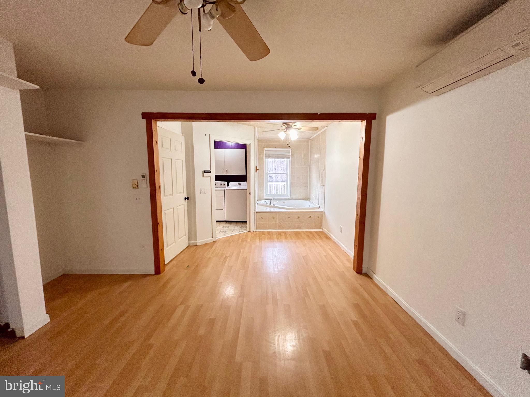208 Justice Way Elkton, MD 21921 - Photo 14 of 23 a view of empty room with wooden floor