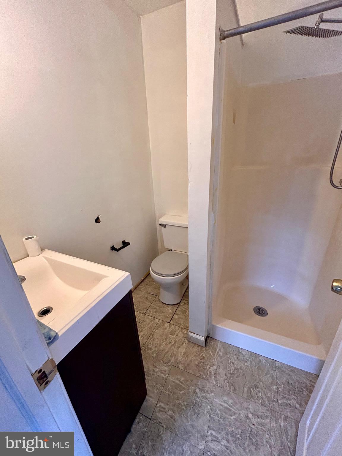 208 Justice Way Elkton, MD 21921 - Photo 19 of 23 a bathroom with a granite countertop sink toilet and shower