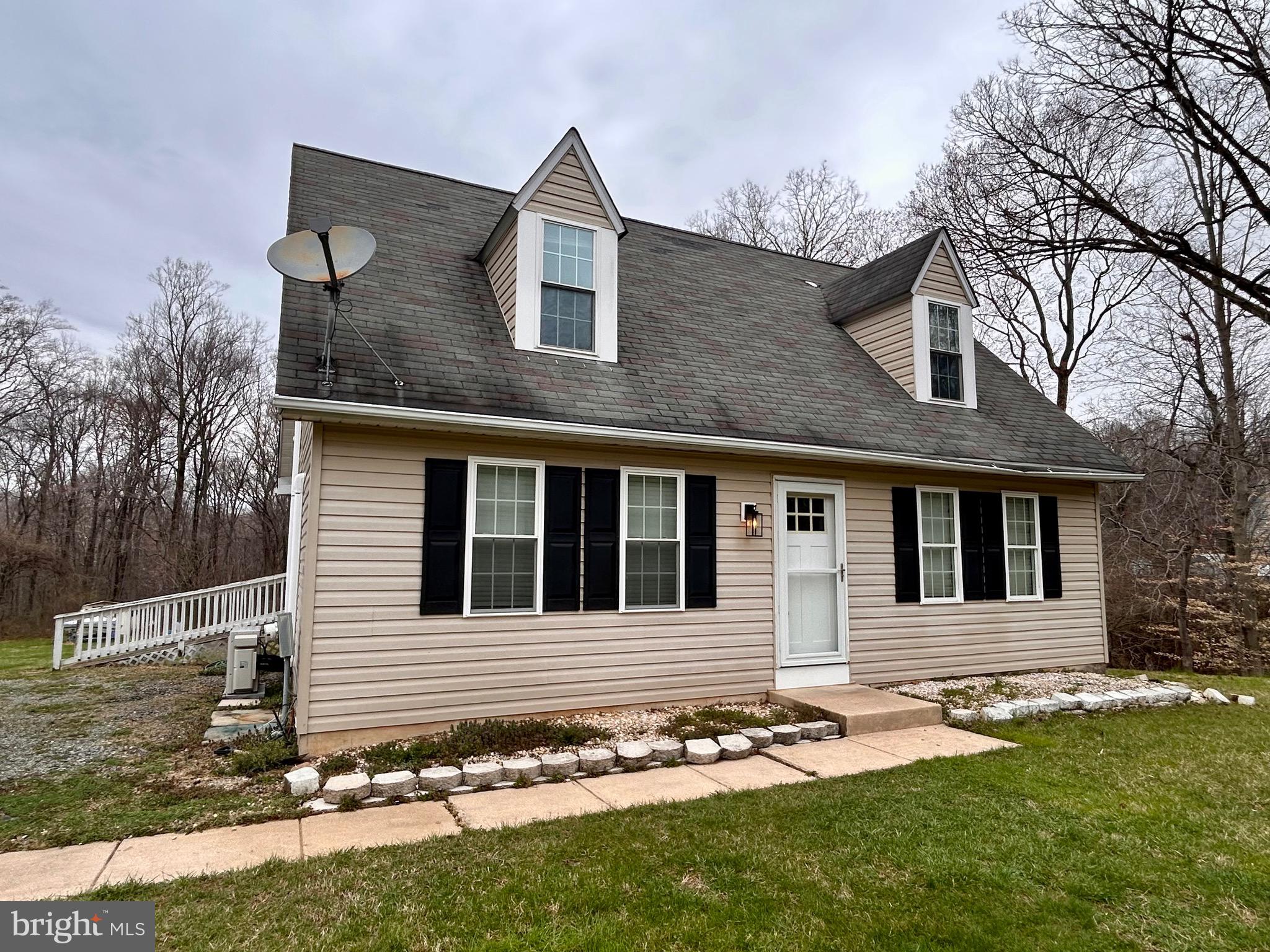 208 Justice Way Elkton, MD 21921 - Photo 5 of 23 a front view of a house with a yard