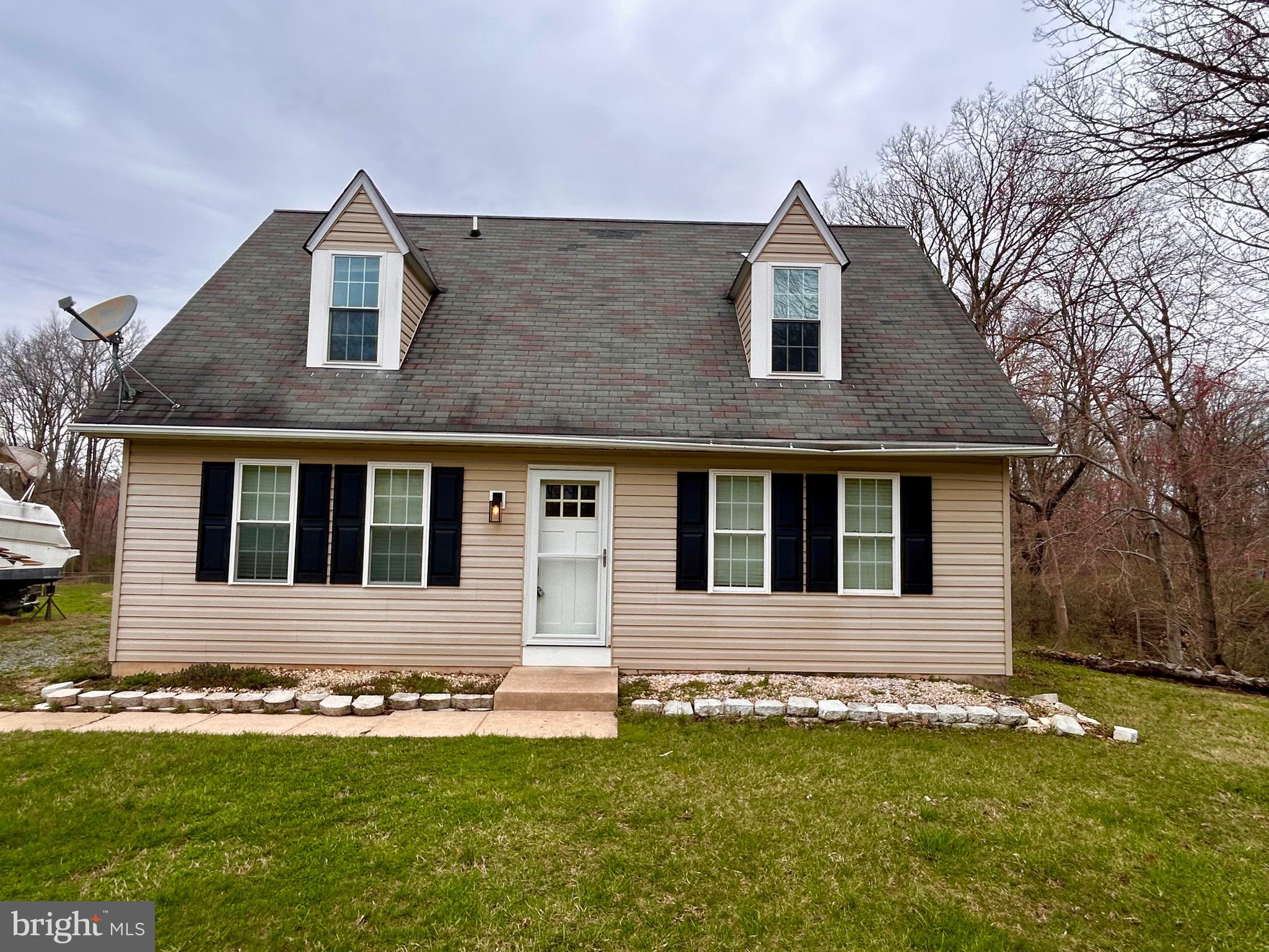 208 Justice Way Elkton, MD 21921 - Photo 6 of 23 a front view of a house with a yard