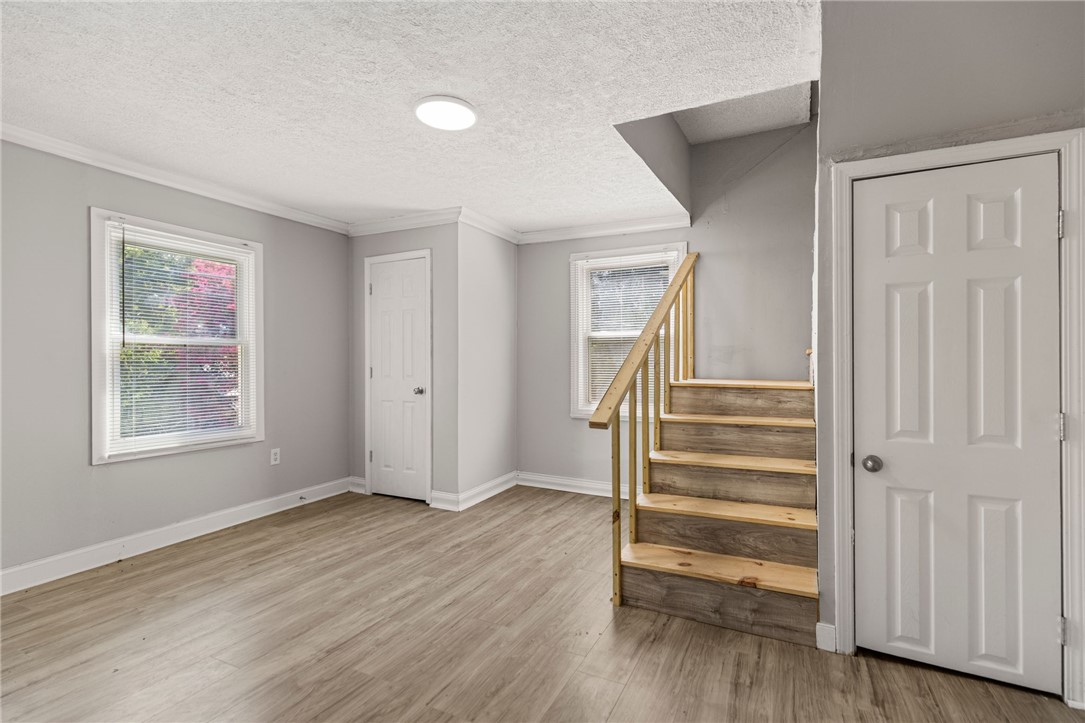 109 Farmer Street Anderson, SC 29621 - Photo 23 of 31 A versatile bonus room features durable flooring and convenient staircase access.