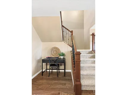 a view of a hallway with seating area