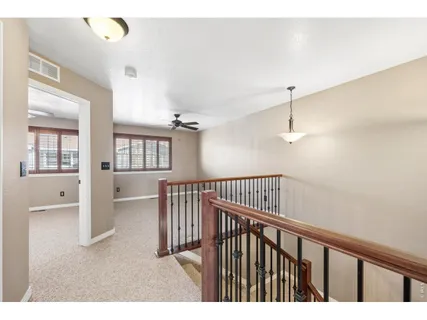 a view interior of a house with wooden floor windows and a fireplace
