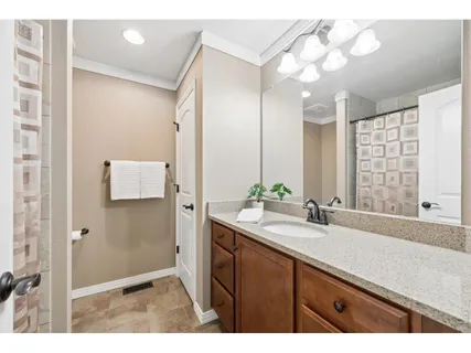 a bathroom with a sink double vanity and a shower