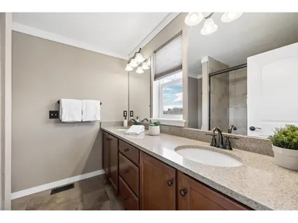 a bathroom with a sink double vanity and a mirror