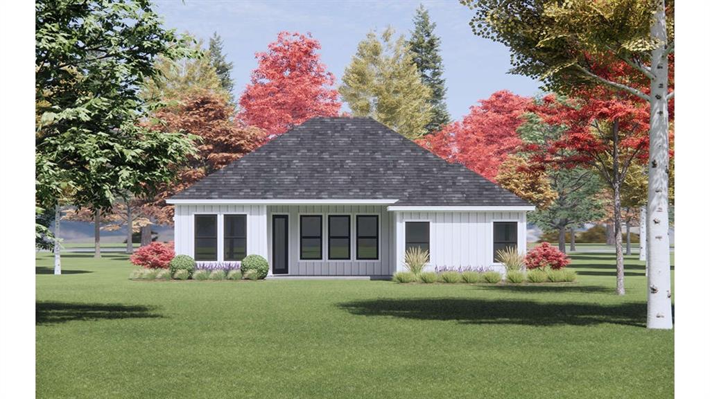 603 Swope Street Rio Vista, TX 76093 - Photo 2 of 5 Rear view of property featuring a lawn, board and batten siding, and roof with shingles