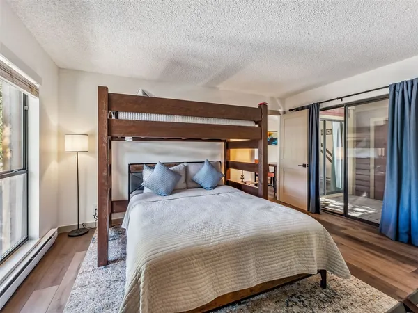 a bedroom with a large bed and a large closet
