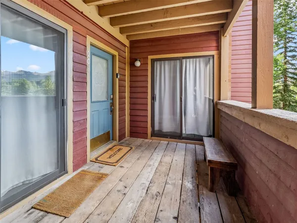 a view of wooden floor and brick walls