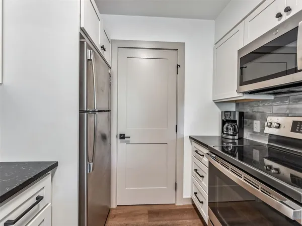 a kitchen with a stove and a microwave