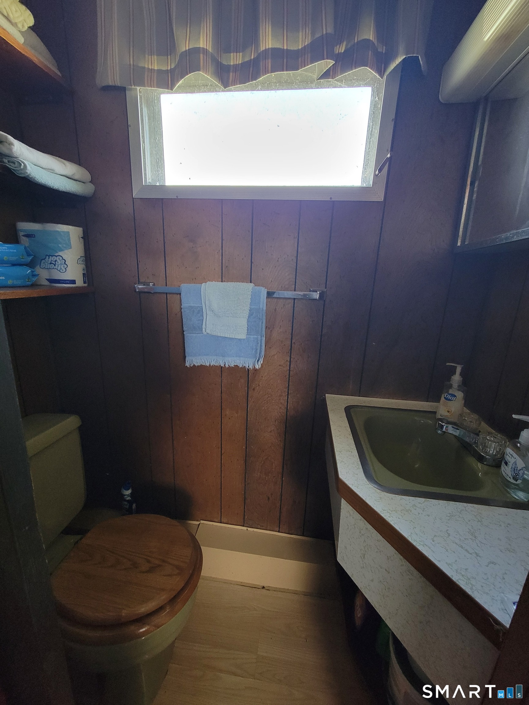 80 Sheldon Road Griswold, CT 06351 - Photo 12 of 12 a bathroom with a toilet sink and mirror
