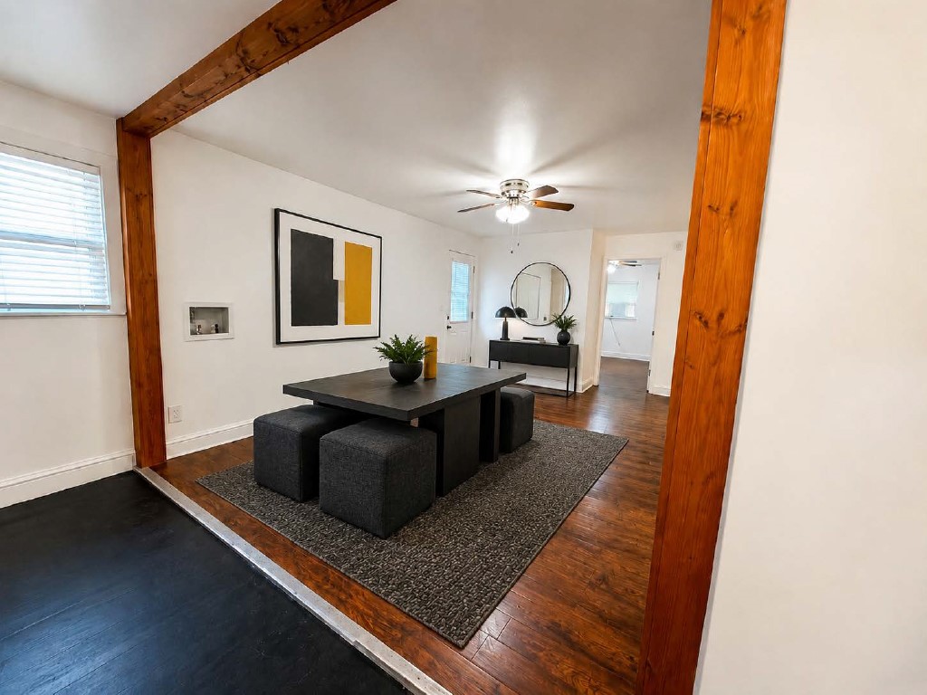 610 Gunter Street Austin, TX 78702 - Photo 13 of 16 Rich hardwood floors complement exposed ceiling beams in this inviting dining space.