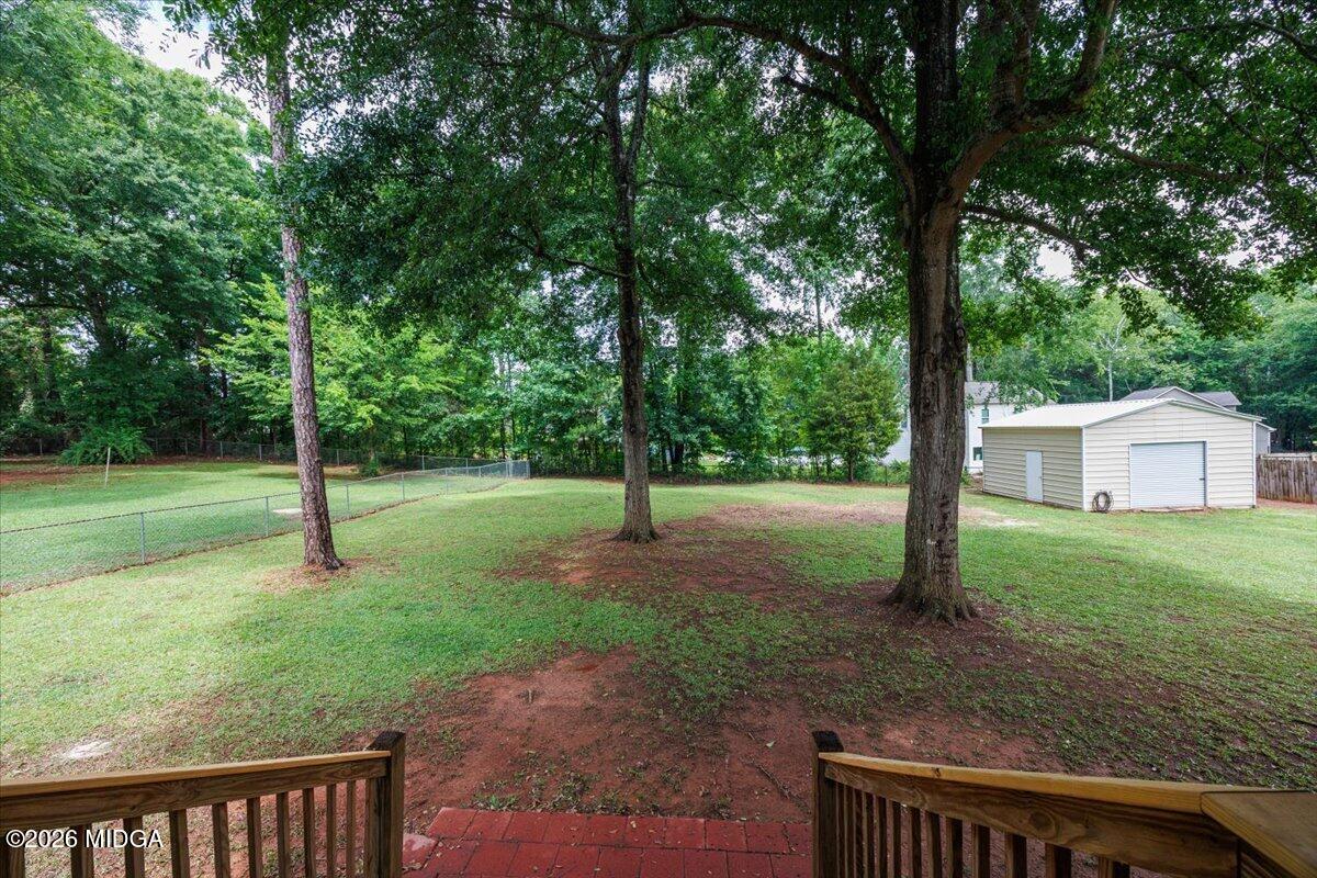 557 Aarons Circle Gray, GA 31032 - Photo 31 of 36 a view of a yard with a tree