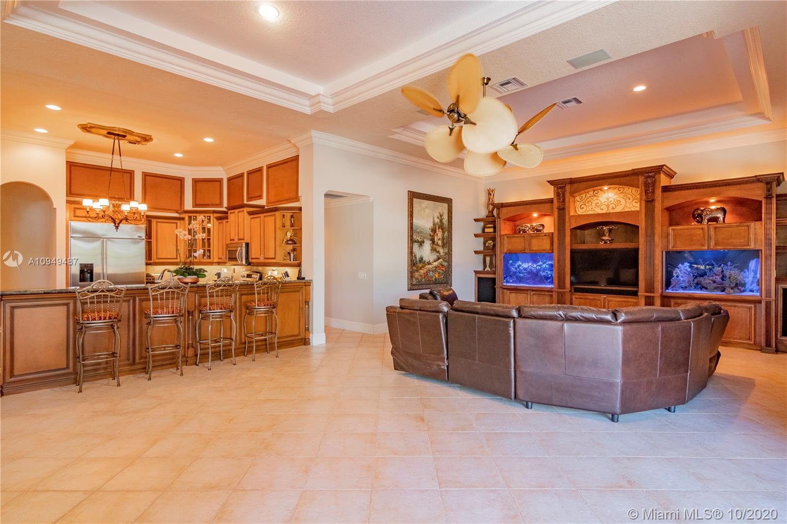2273 Southwest 132nd Way Davie, FL 33325 - Photo 13 of 48 a living room with couches and kitchen view