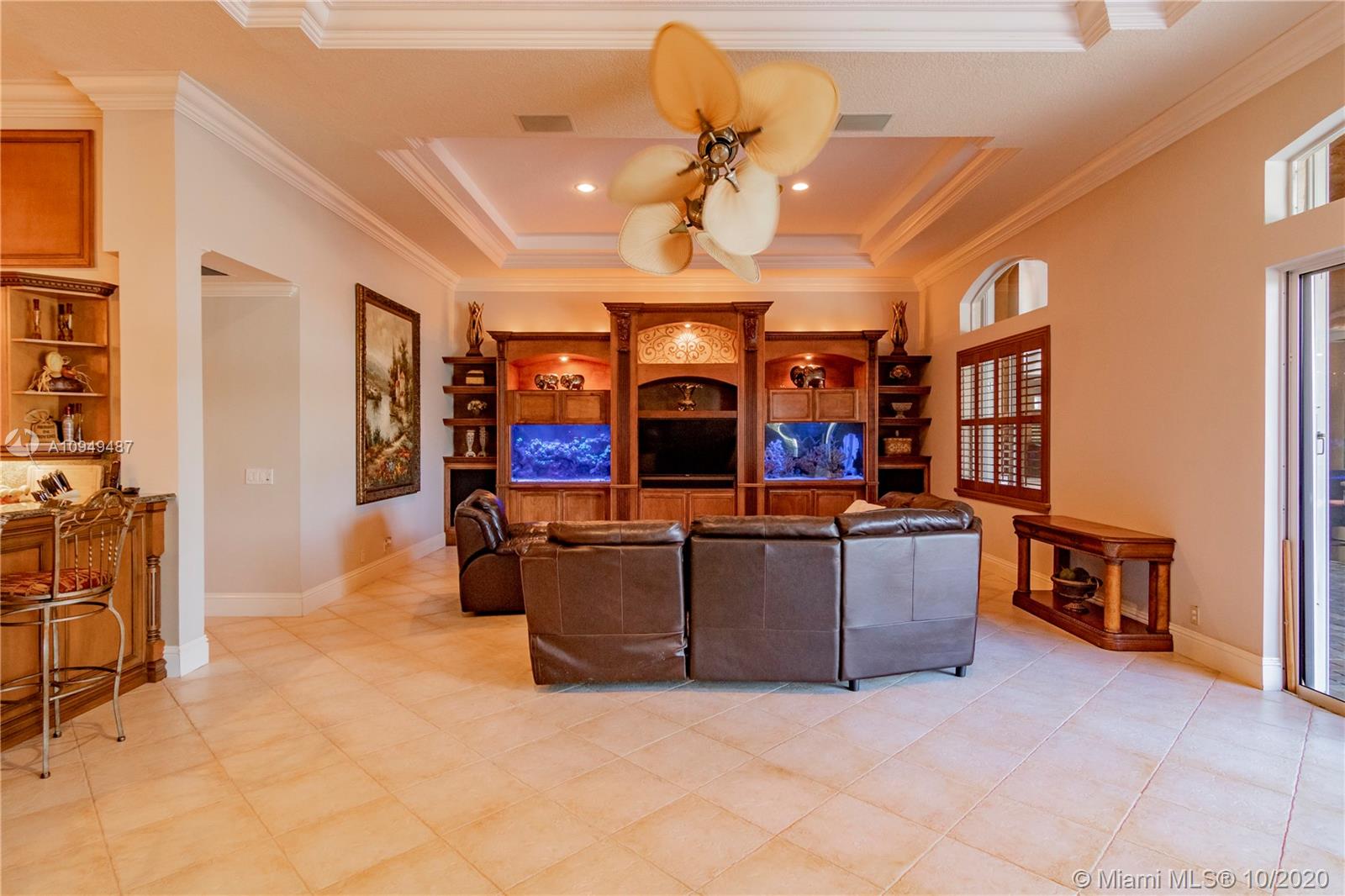 2273 Southwest 132nd Way Davie, FL 33325 - Photo 14 of 48 a living room with furniture and a flat screen tv