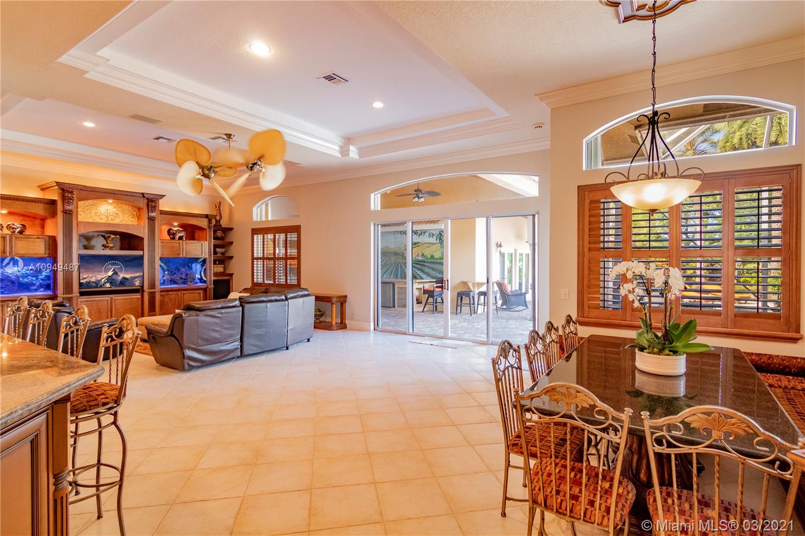 2273 Southwest 132nd Way Davie, FL 33325 - Photo 15 of 48 a living room with furniture and a chandelier