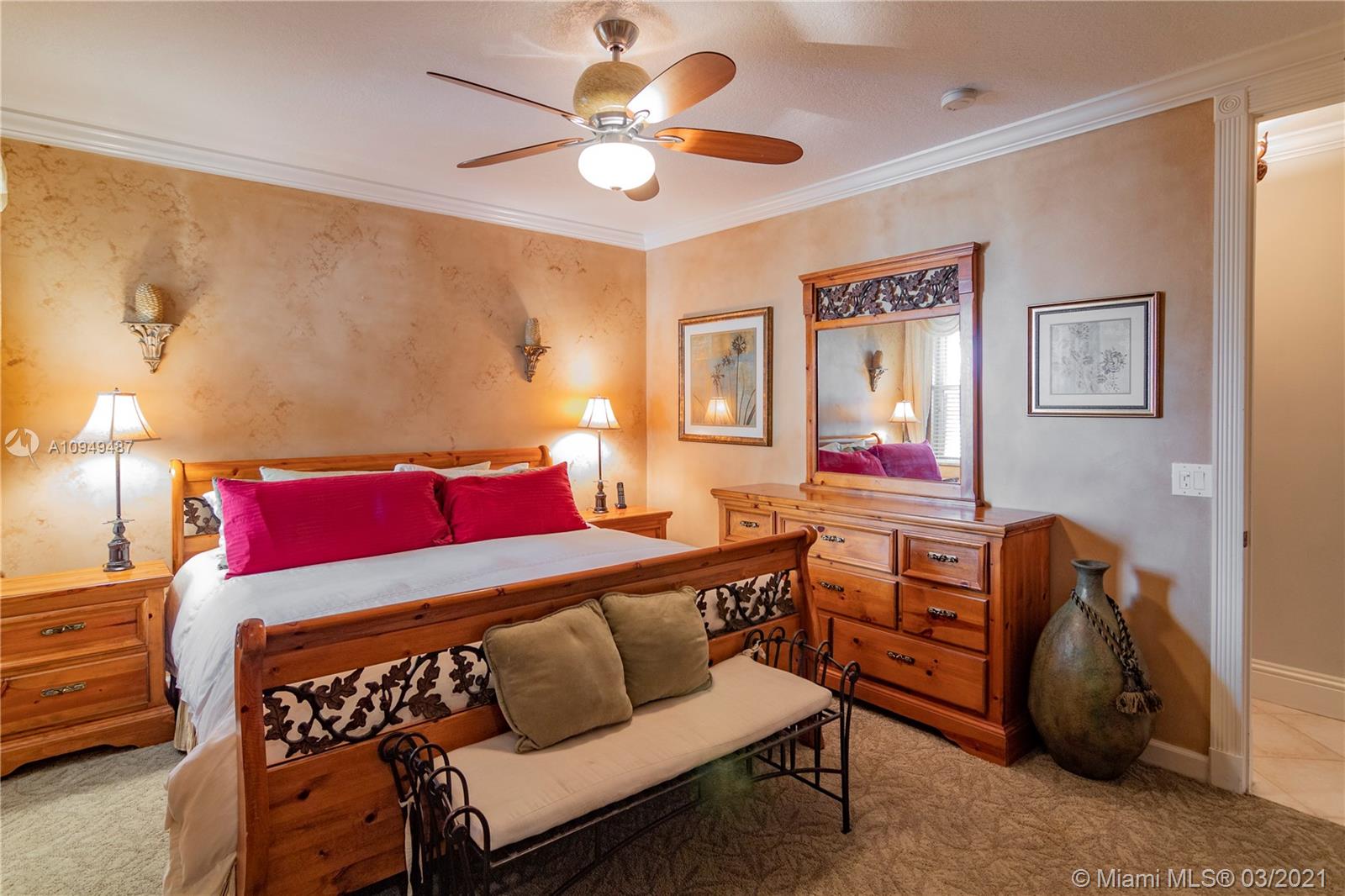 2273 Southwest 132nd Way Davie, FL 33325 - Photo 16 of 48 a bedroom with furniture and a chandelier