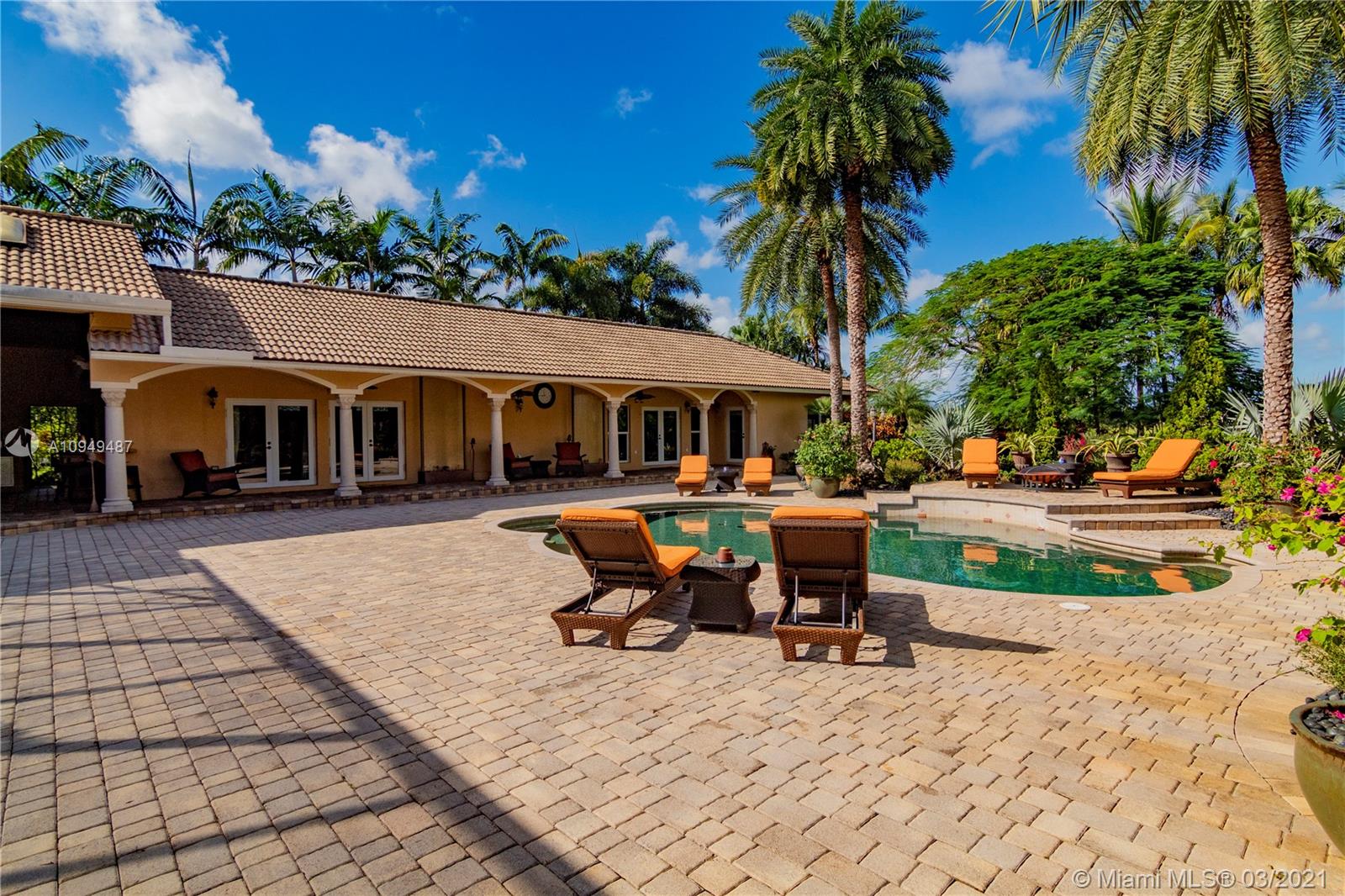 2273 Southwest 132nd Way Davie, FL 33325 - Photo 27 of 48 a front view of a house with garden