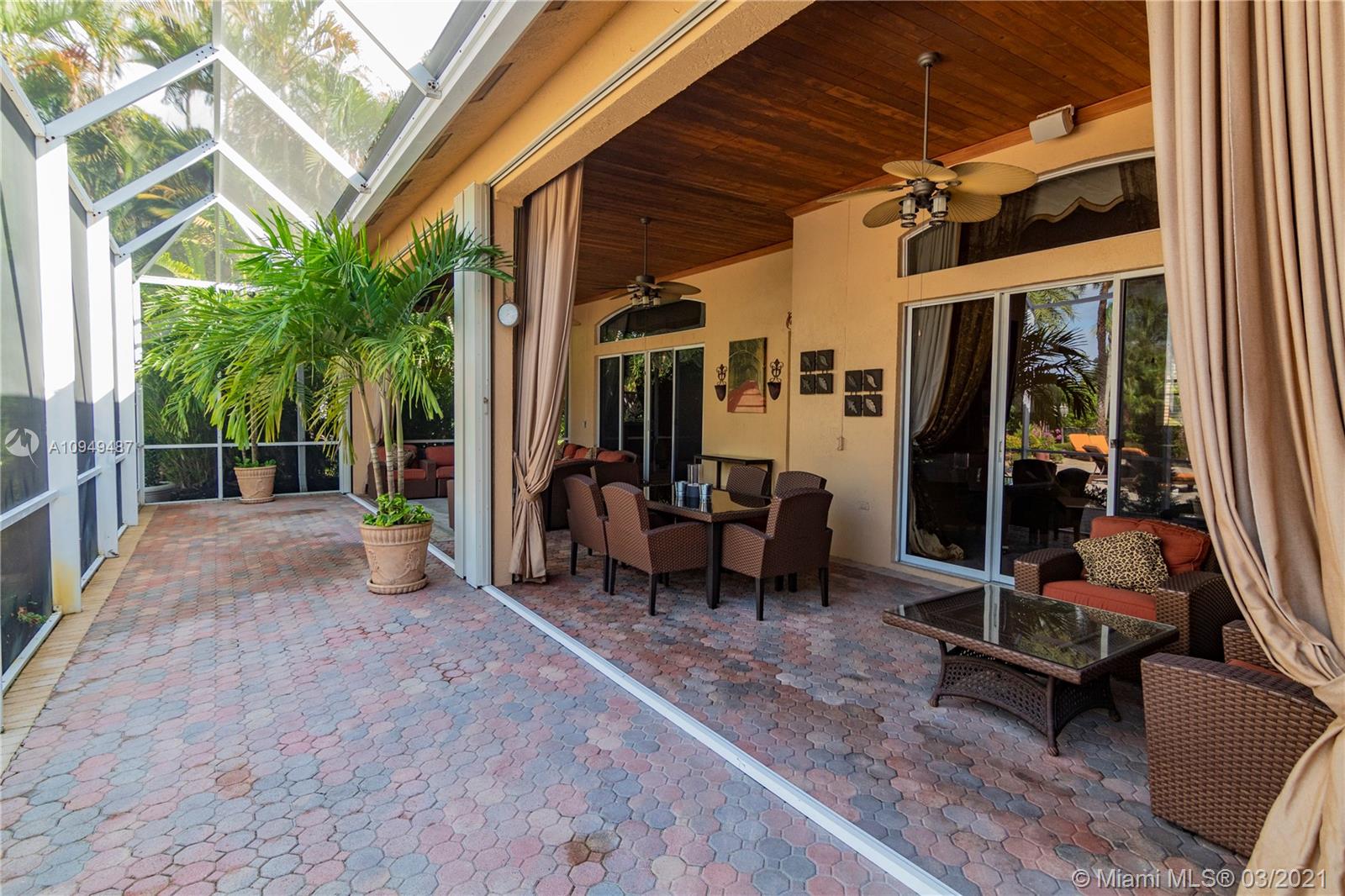 2273 Southwest 132nd Way Davie, FL 33325 - Photo 28 of 48 a view of a patio with a table and chairs