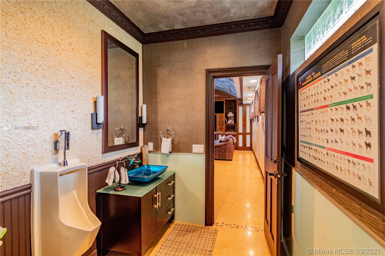 2273 Southwest 132nd Way Davie, FL 33325 - Photo 34 of 48 a bathroom with a sink mirror and a bathtub