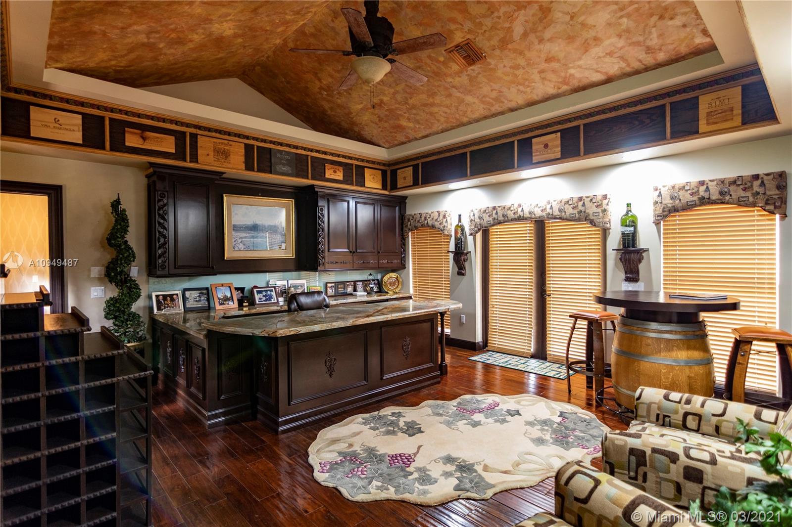 2273 Southwest 132nd Way Davie, FL 33325 - Photo 35 of 48 a kitchen with stainless steel appliances granite countertop a stove and a wooden cabinets